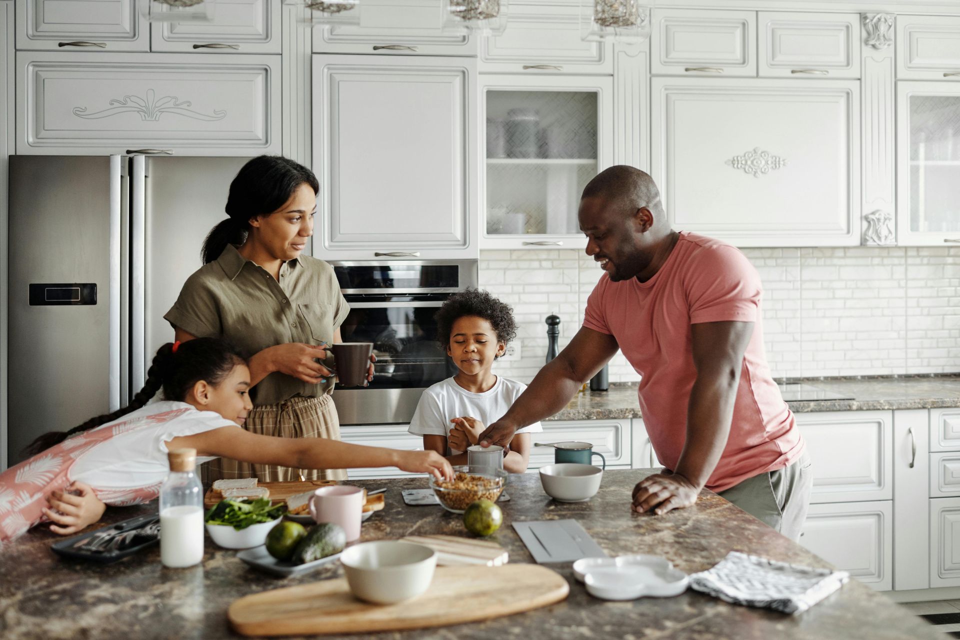 A happy family having breakfast together in their stylish kitchen, fostering love and togetherness.
